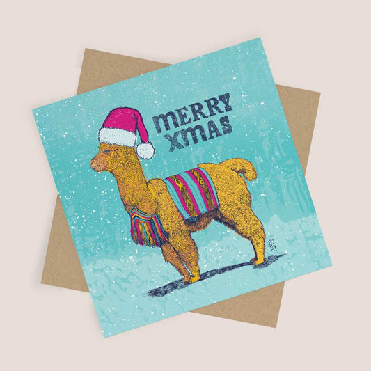 Illustrated Christmas card featuring an alpaca in a Santa hat with a colourful blanket, set against a snowy blue background with the text "Merry Xmas.