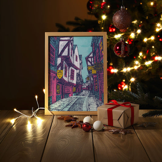 Illustrated winter print of The Shambles in York, showcasing timber-framed buildings and cobblestone streets in a vibrant seasonal colour palette.