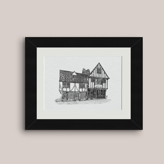 Detailed mounted black and white pen drawing print of a timber framed house in York, black frame